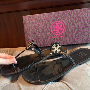 Tory Burch Black Mini Miller flat thong sandals.